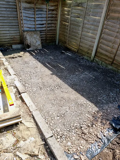 Compacted sub-base prepared for new patio paving