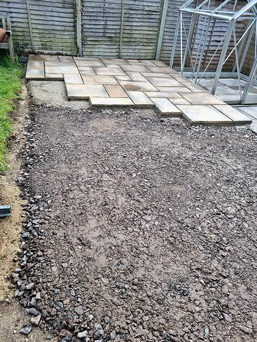 Extended patio area prepared with a new sub-base