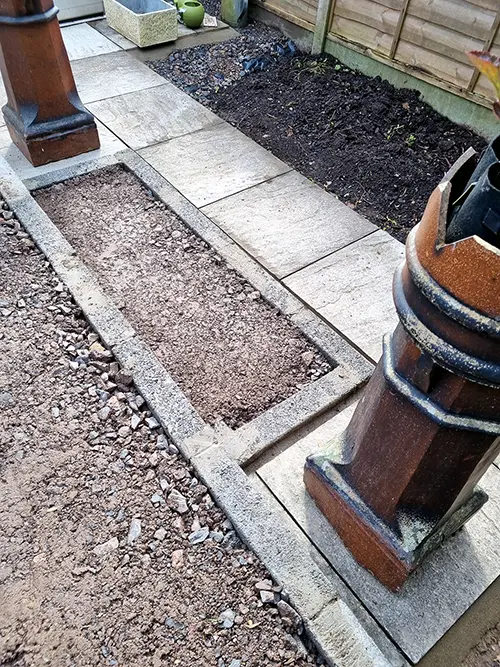 Patio edging and planting bed under construction