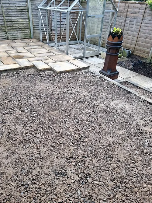 Patio layout and ground preparation around the greenhouse